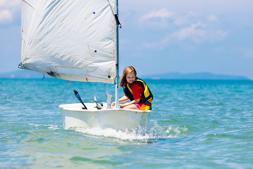 A pupil learning to sail a dinghy