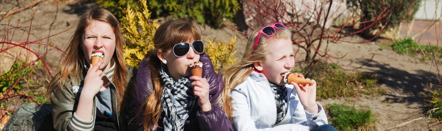 People eating ice creams in the sunshine