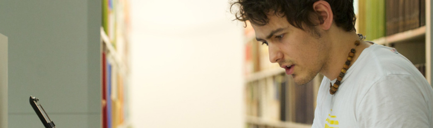 A young man looking at his computer