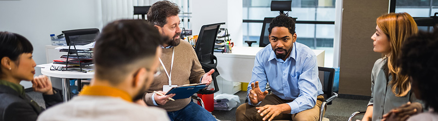 A stock picture of a meeting of care professionals