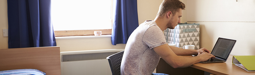 A young man on a laptop computer