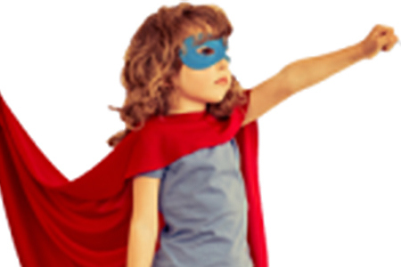 A young girl dressed as a superhero