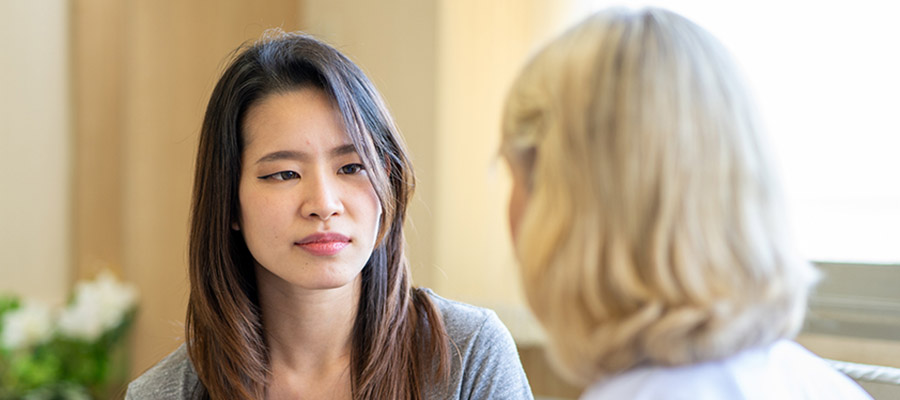 A generic image of a counsellor talking to a young person.