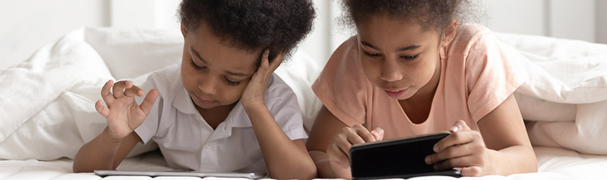 A brother and sister reading together