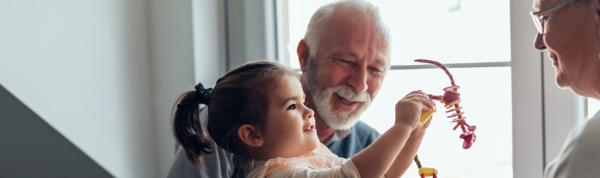 A grandparent playing with a young child