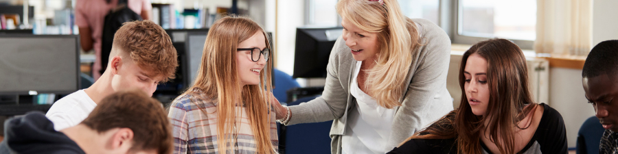 A teacher helping a pupil