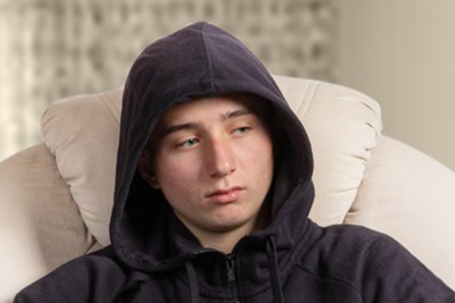 A young man sitting at home