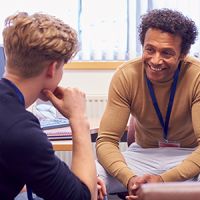 A teenager talking to his social worker