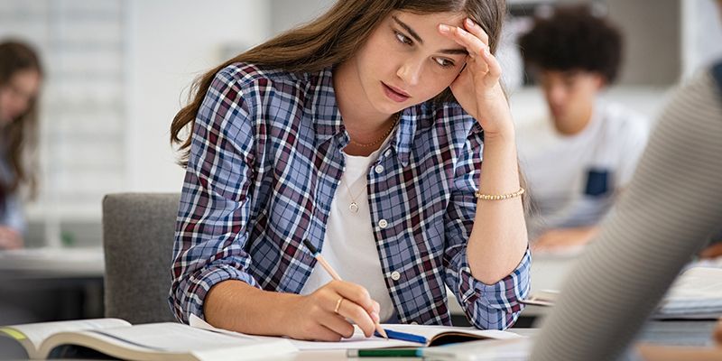 A teenager studying