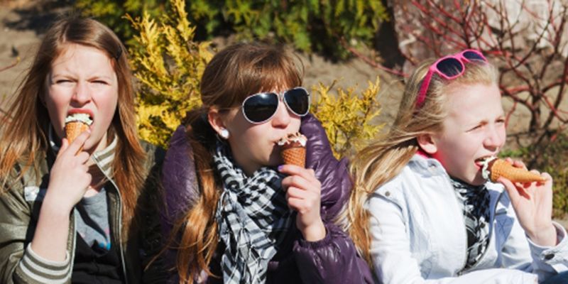 A child eating ice cream in the sunshine