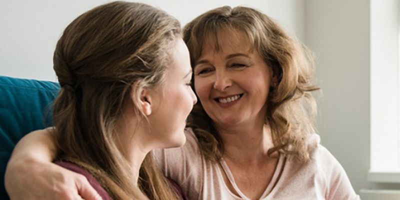 A mother and daughter chatting