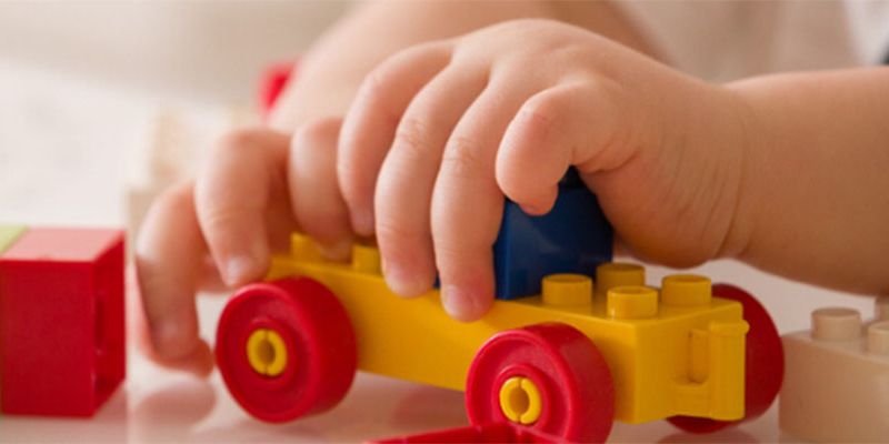 A child holding a toy