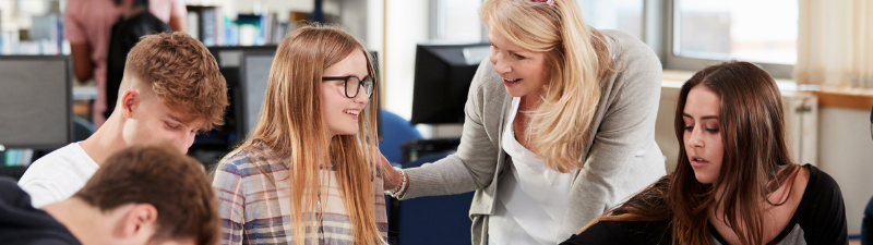 A teacher helping a pupil