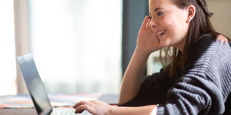 A young woman on a computer