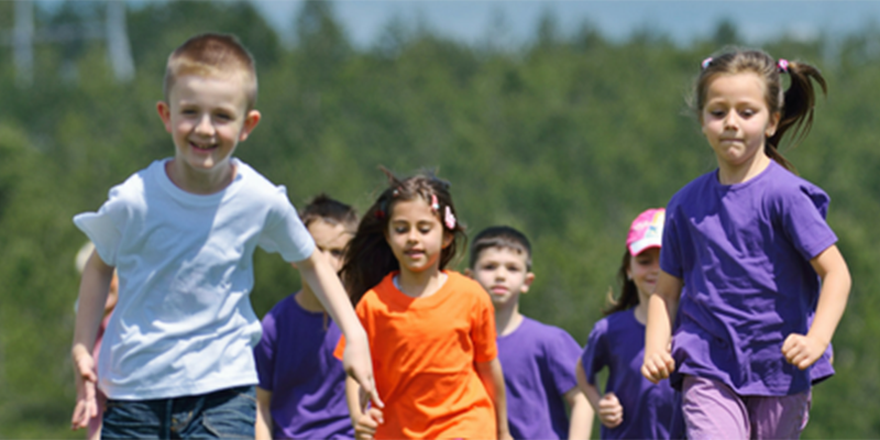 A group of children running to camera