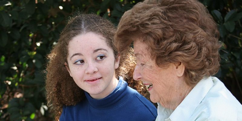 A young person chatting to their grandparent