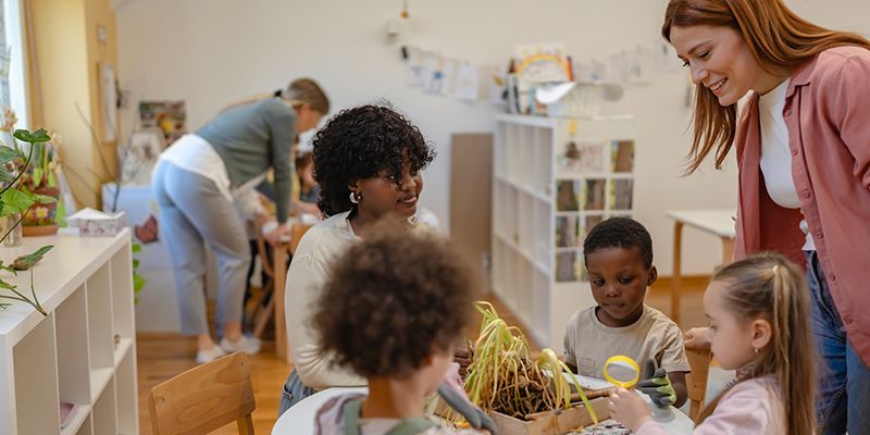 A stock image of young children in a kindergarden