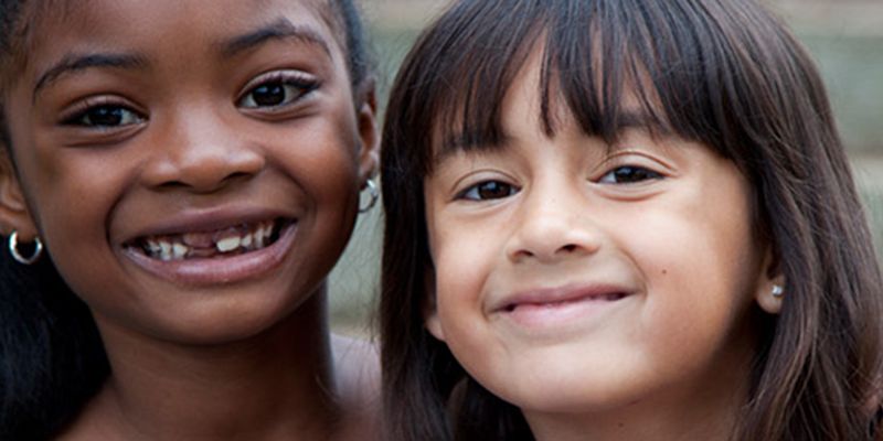 Two children smiling to camera