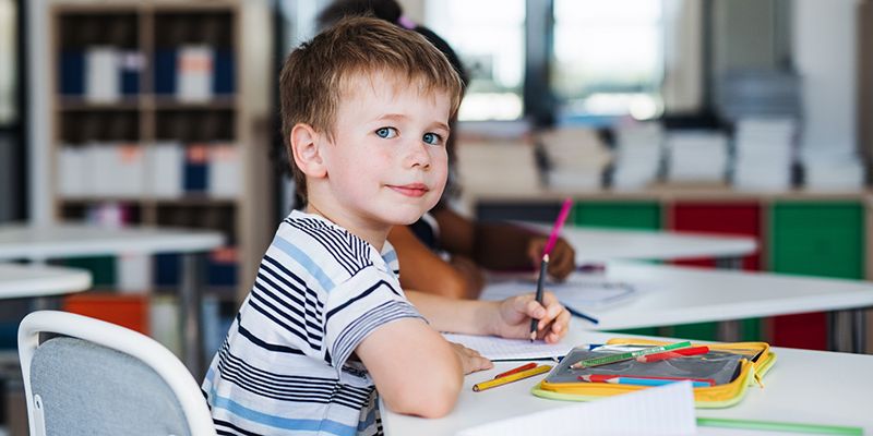 Child in school colouring