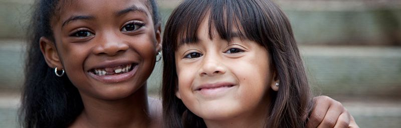 Two children smiing to camera