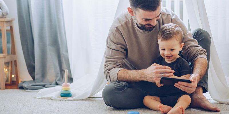 A father and child playing at home